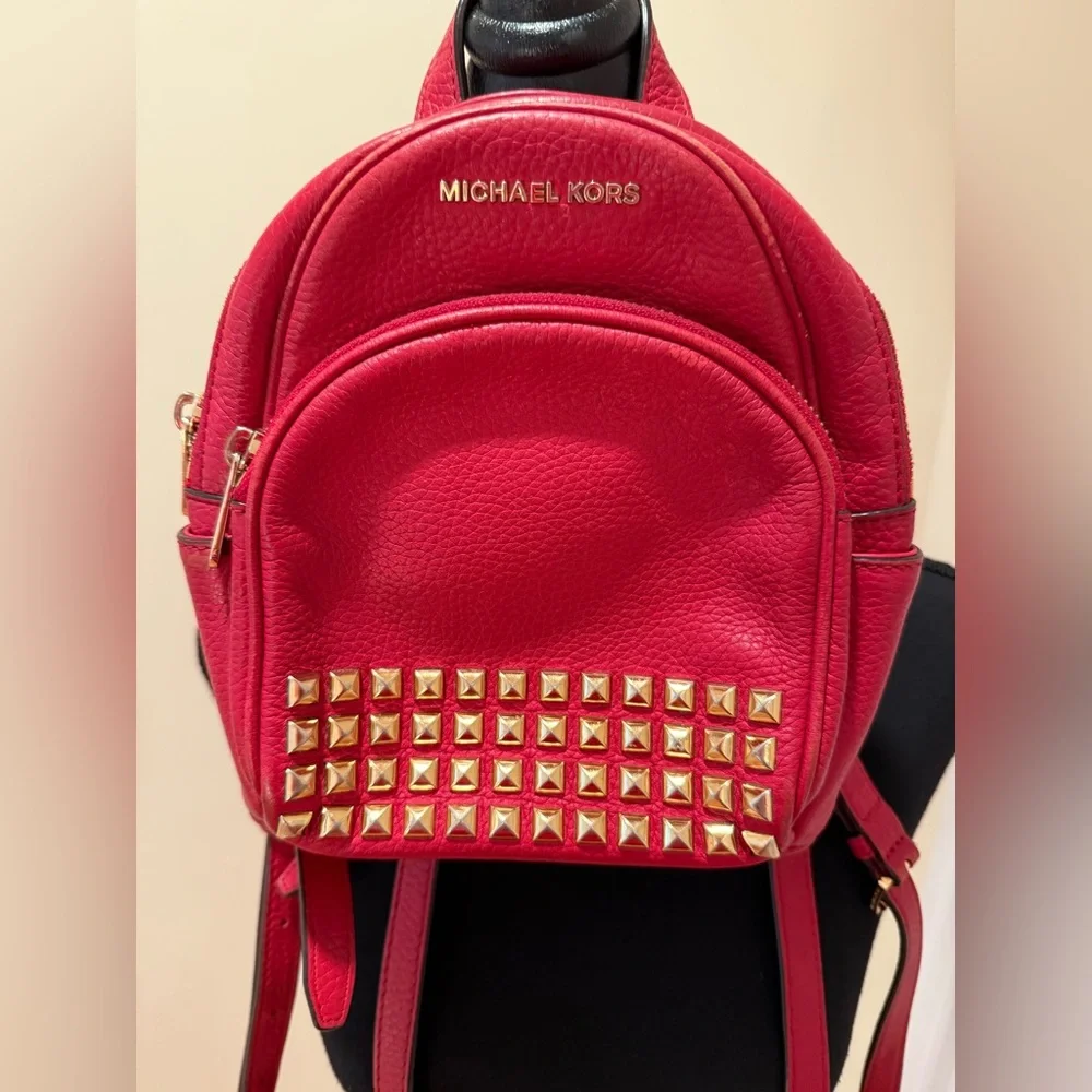 Michael Kors Abbey XS Studded Red Backpack with Gold Studs
Size 7 by 8 by 3 - Picture 3 of 16